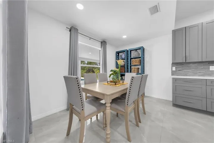 Dining room with baseboards and recessed lighting