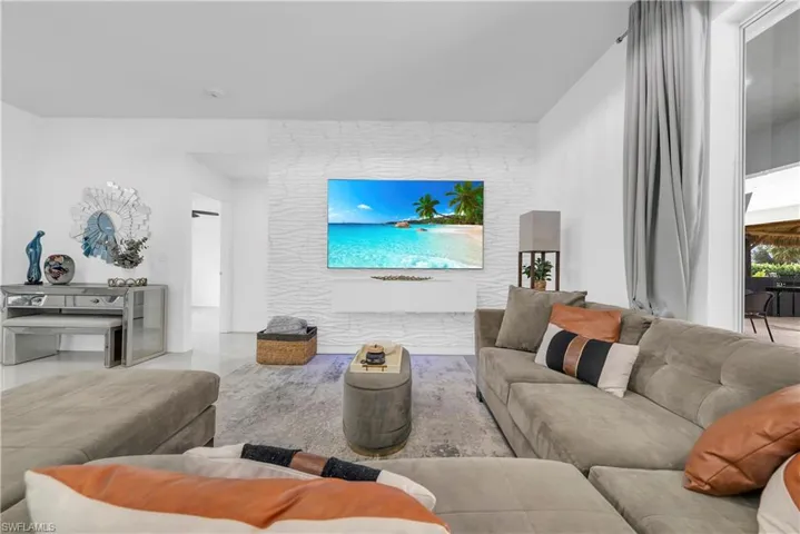 Living room featuring an accent wall