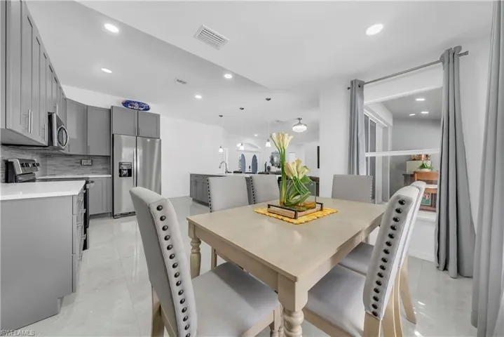 Dining space featuring recessed lighting