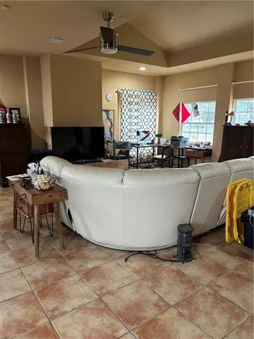 Living room with light tile patterned floors