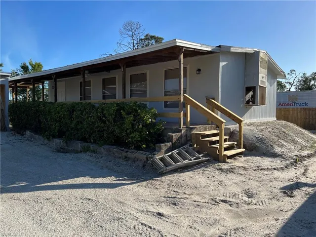 Back of house with a porch