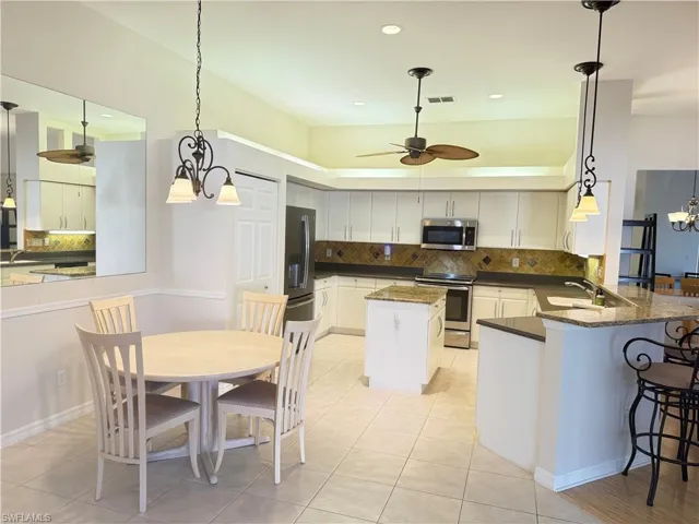 Lots of cabinets and Stainless steel appliances