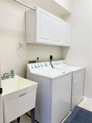 In house laundry room with a laundry tub
