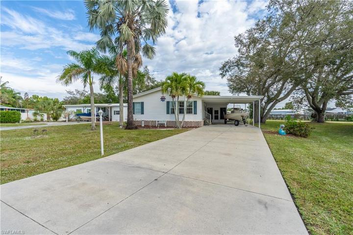 Front of Home and expansive driveway