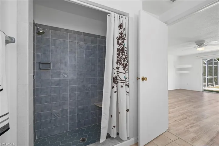 Primary Bathroom featuring tile flooring, toilet, and vanity