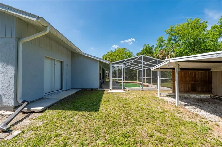 View of yard with a lanai