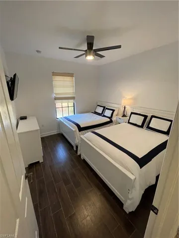 Bedroom featuring wood finish floors and a ceiling fan