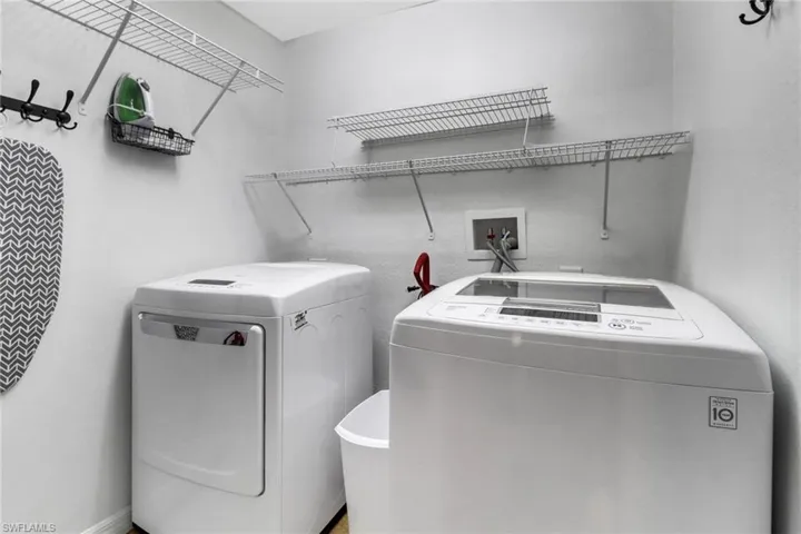 Laundry room featuring washing machine and clothes dryer