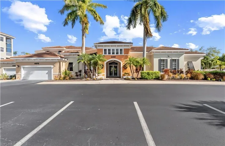 Mediterranean / spanish-style house with french doors, stucco siding, and uncovered parking