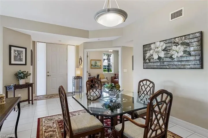 Dining room with light tile patterned floors