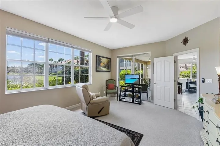 Bedroom featuring carpet and ceiling fan