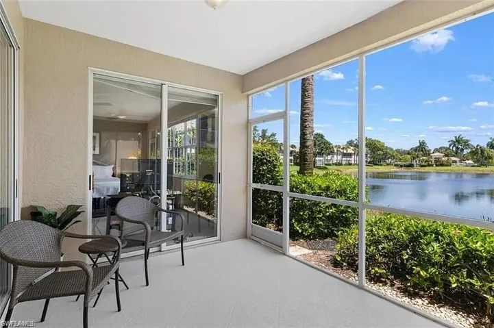 Sunroom / solarium with a healthy amount of sunlight and a water view