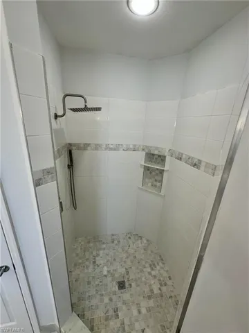 Full bath featuring a stall shower