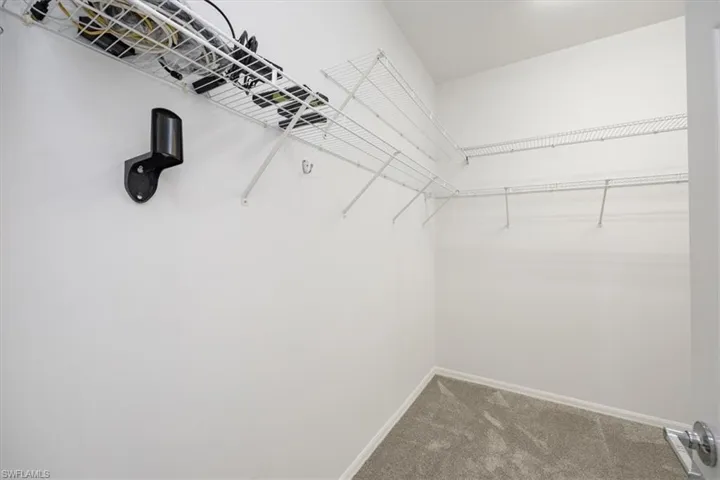 Large walk-in primary closet.