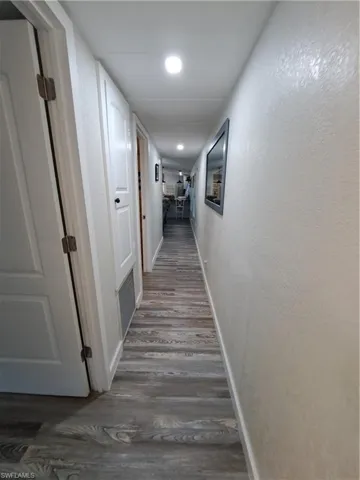 Hall featuring dark hardwood / wood-style flooring