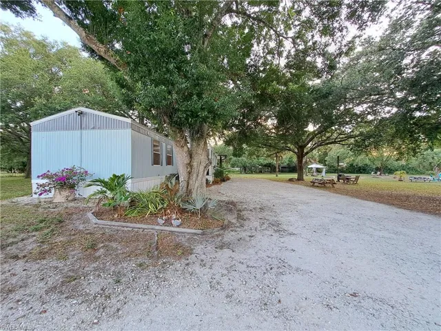 View of yard with an outdoor structure