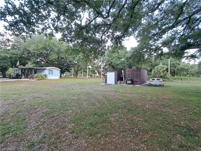 View of yard featuring a shed