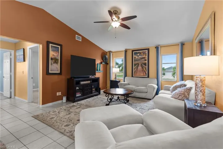 Living area featuring vaulted ceiling