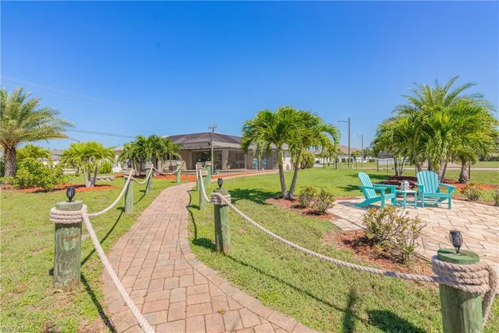 Paved walking path from pool to dock