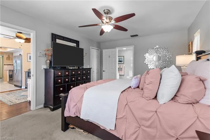 Primary bedroom with walk-in closet