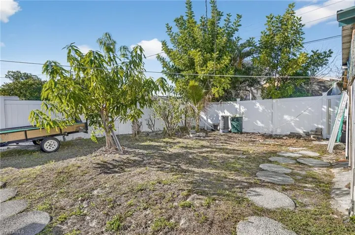 View of fenced backyard
