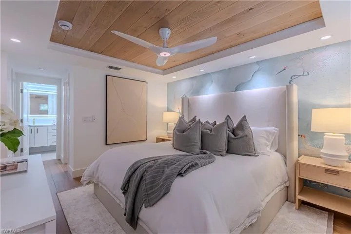 Bedroom featuring recessed lighting, a raised ceiling, wooden ceiling, and light wood finished floors