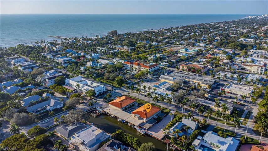 Drone / aerial view with a water view and a residential view