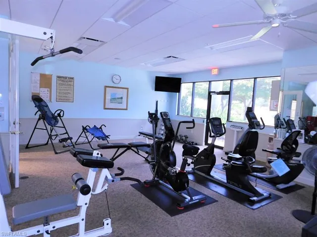 Exercise room with a ceiling fan