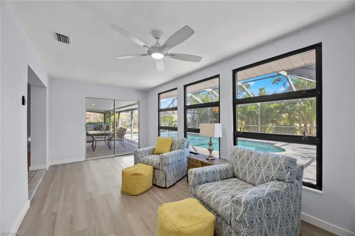 Sunroom/Den overlooking lanai and pool