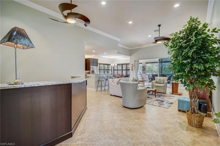 Open Living Floor Plan- Wet Bar, family room, kitchen, and lanai.