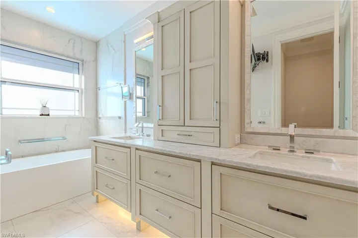 Bathroom with a tub and vanity