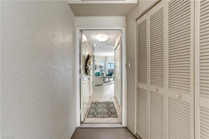 Views even from the front door! Corner condos have a long screened enclosed front porch with extra storage.