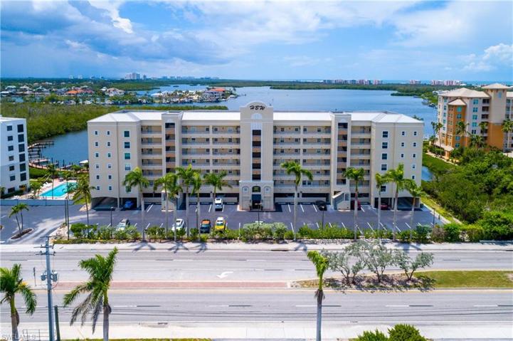 Front view of condo with plenty of guest parking spaces.