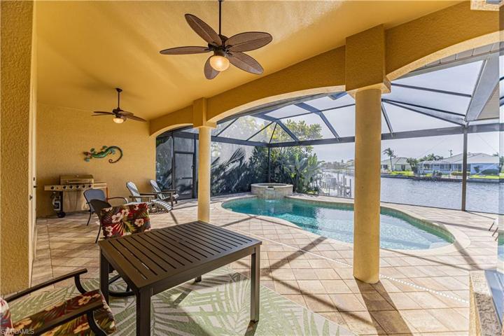 Outdoor patio area overlooking the pool, spa and water