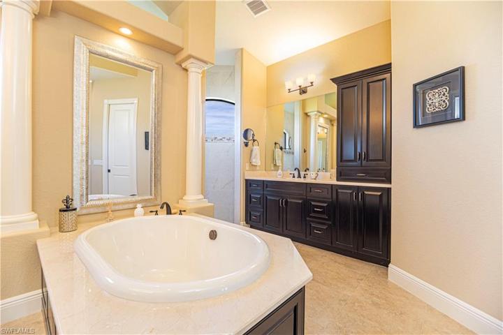 Huge owner's suite bathroom w/ standalone tub & roman shower