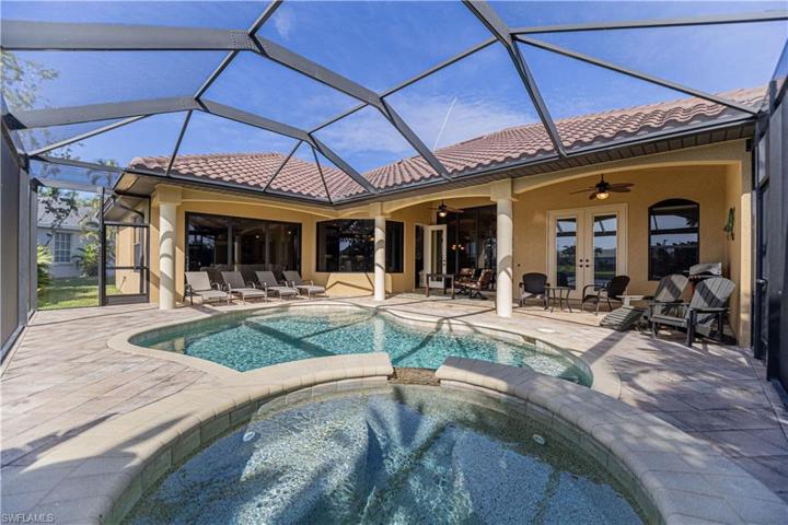 Outdoor patio area overlooking the pool, spa and water