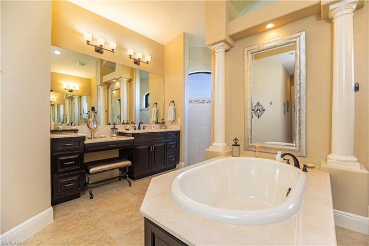 Huge owner's suite bathroom w/ standalone tub & roman shower
