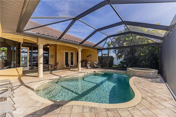 Outdoor patio area overlooking the pool, spa and water