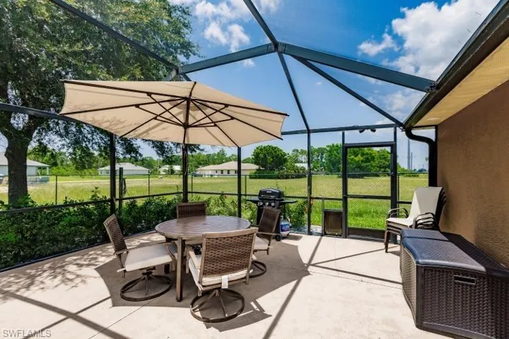 View of patio / terrace featuring glass enclosure