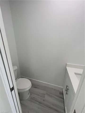 Bathroom featuring vanity and light wood-style floors