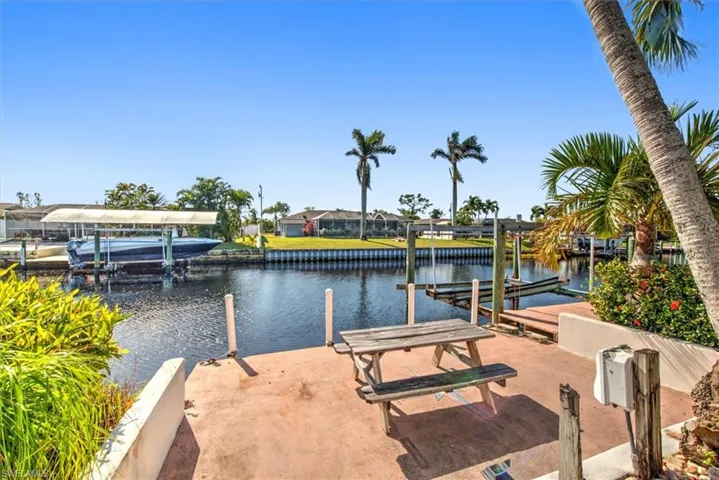 Dock featuring a water view and boat lift