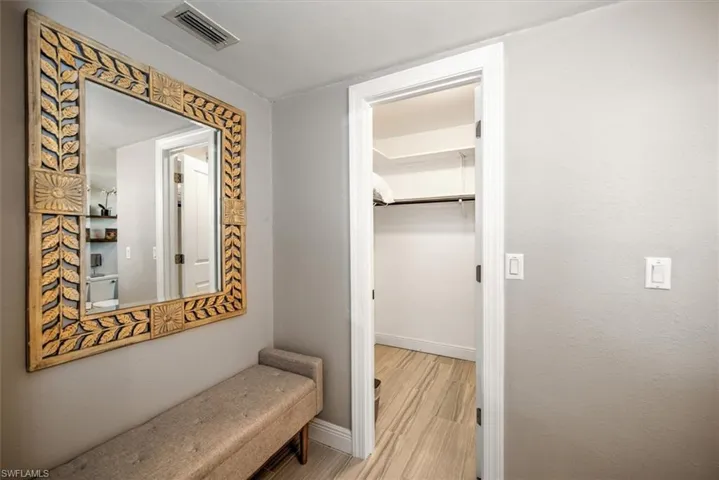 Hallway featuring baseboards and light wood-type flooring