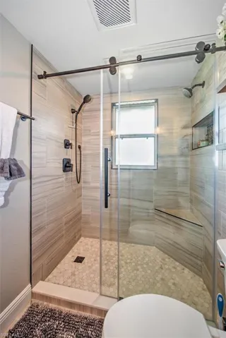 Full bathroom with a stall shower