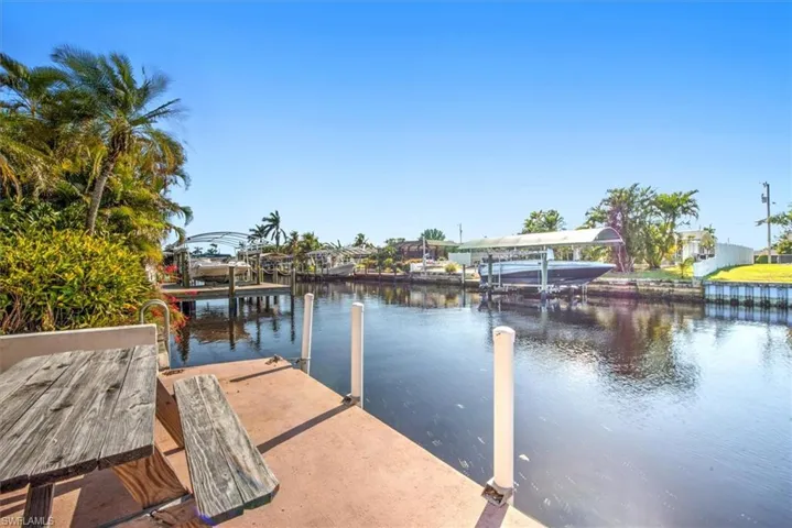 Dock with a water view and boat lift