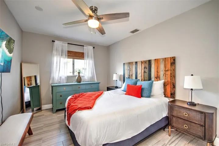 Bedroom featuring light wood-style flooring and a ceiling fan