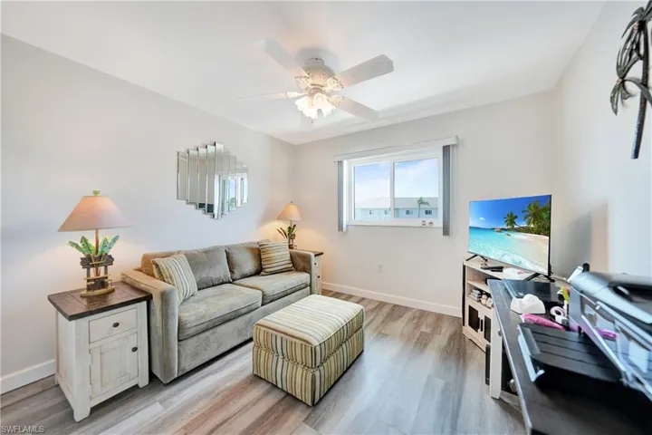 Guest bedroom featuring ceiling fan and light hardwood / wood-style flooring