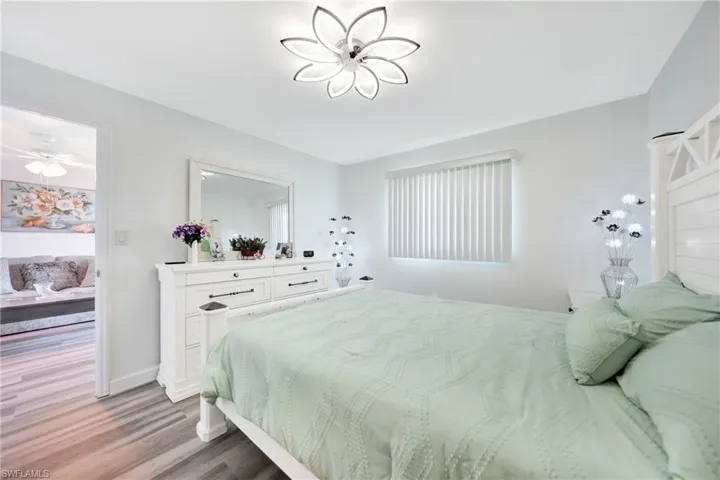 Bedroom featuring dark hardwood / wood-style floors