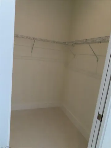 Walk in closet featuring tile patterned floors