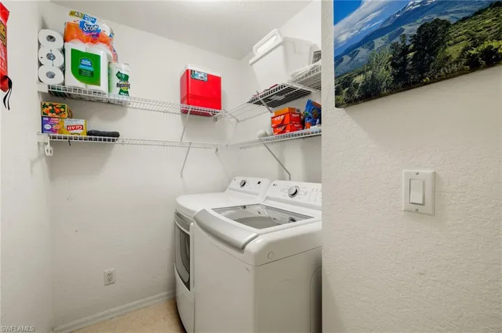 Clothes washing area featuring independent washer and dryer