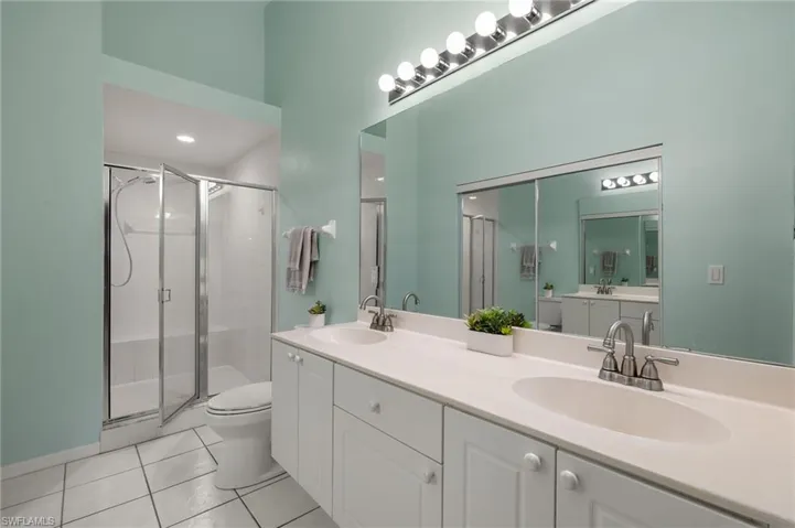 Primary ensuite with walk in shower and closet, volume ceilings